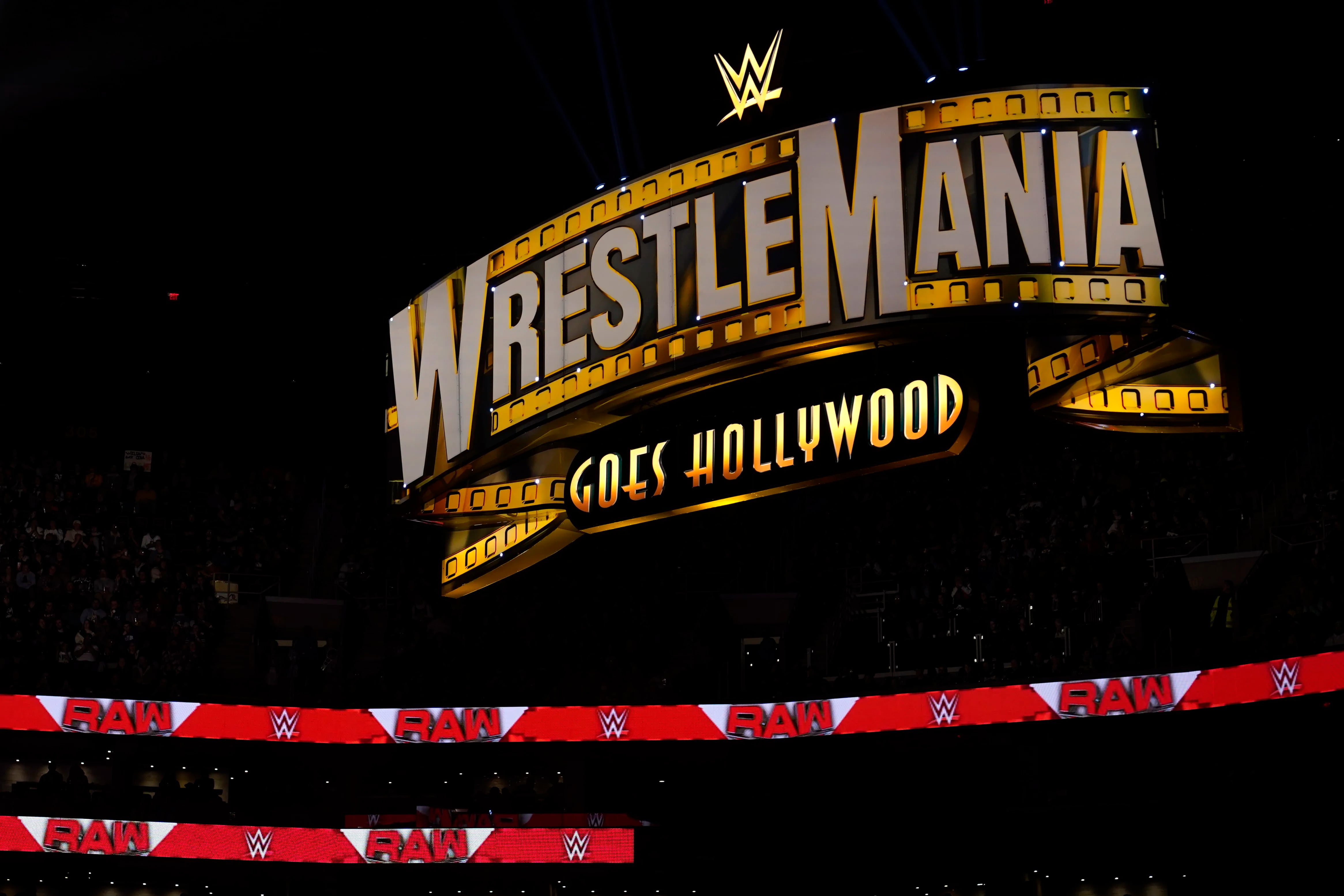 A WrestleMania sign hangs over the crowd during s WWE "Monday Night RAW" event in Boston in March.