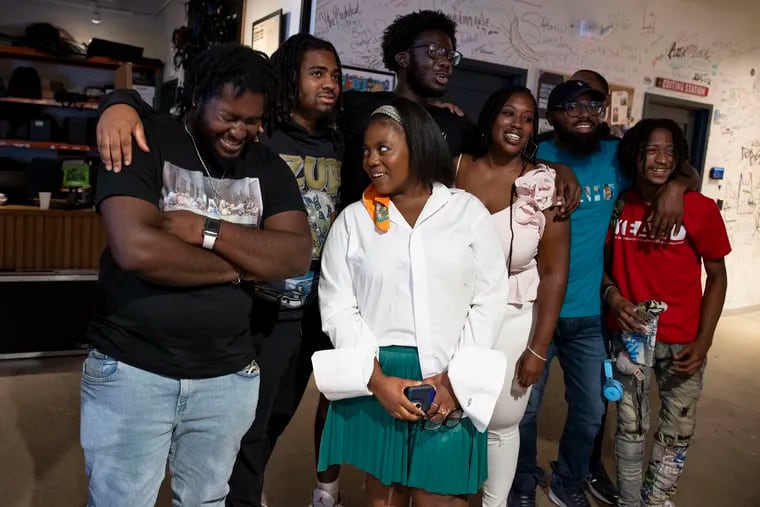 The YEAH Philly team posed for a photo after winning the social media pitch contest on Aug. 12. Kendra Van de Water (third from right) and James Aye (second from right) are the cofounders of YEAH Philly, a West Philadelphia-based program that works with young people impacted by the criminal justice system.