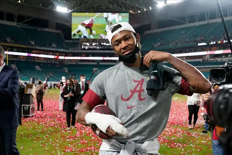 Alabama wide receiver DeVonta Smith leaves the field after their win against Ohio State in an NCAA College Football Playoff national championship game, Tuesday, Jan. 12, 2021, in Miami Gardens, Fla. Alabama won 52-24. (AP Photo/Lynne Sladky)