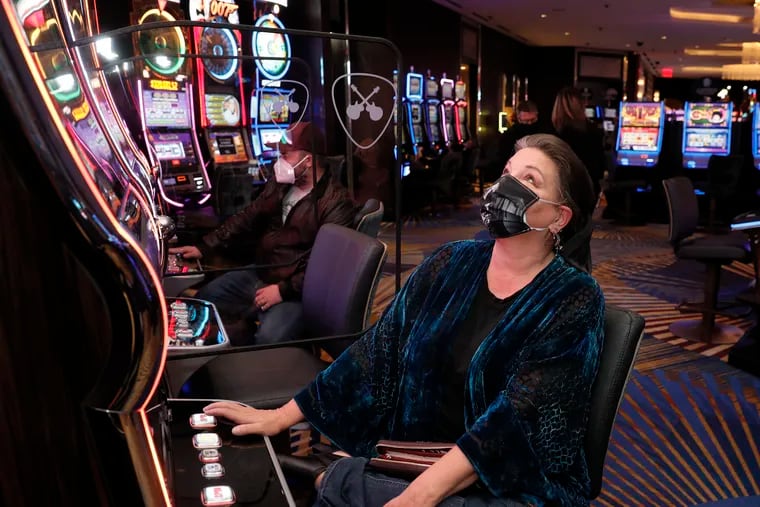 Debbie Lynch of Burlington County plays the Buffalo Inferno slot machine at the Hard Rock Hotel & Casino Atlantic City in December.