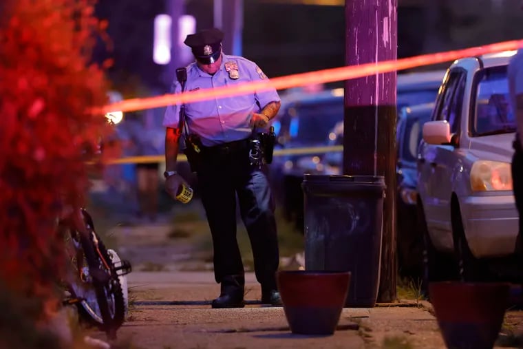 Investigators searched for clues after a drive-by shooting last month in which four people were shot in the 5300 block of Charles Street in the Wissinoming section of the Lower Northeast.
