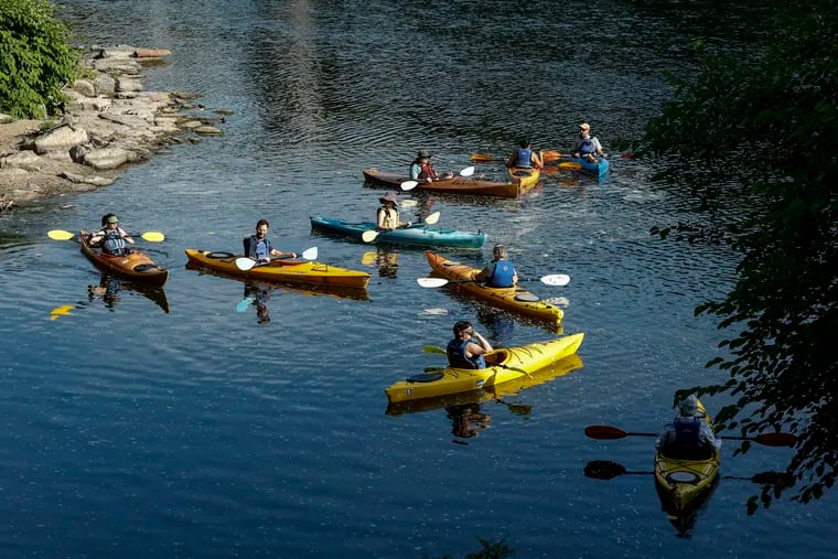 Philadelphia Canoe Club hosts a Thursday Night Social Paddle where nonmembers rent kayaks and tour the Schuylkill. The social paddle is pictured on the Schuylkill on Thursday, June 20, 2024.