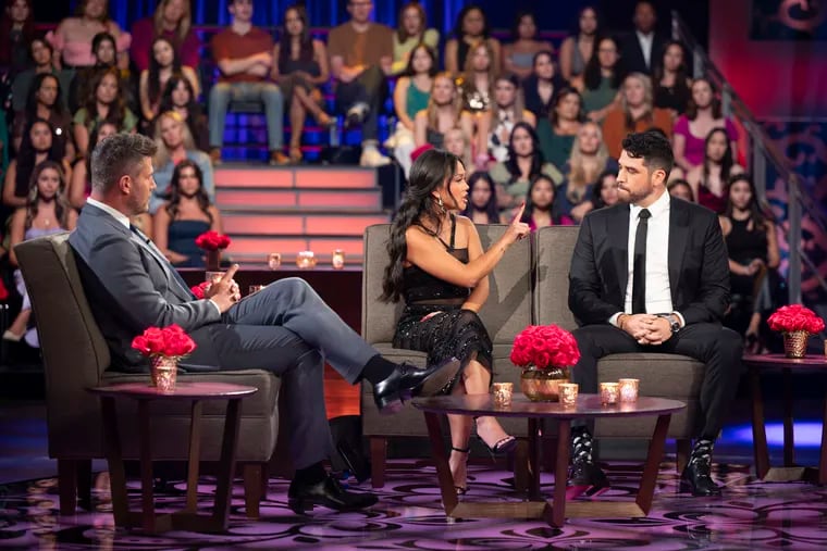 A live studio audience watches along as Jesse Palmer sits down with Jenn Tran and  her final rose selection, Devin Strader, who she proposed to. Tran revealed that Strader broke up with her shortly after filming wrapped.