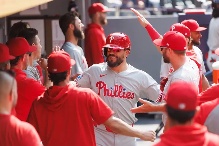 Kyle Schwarber celebrates in the dugout after hitting a solo home run to lead off the game on Wednesday in Toronto.