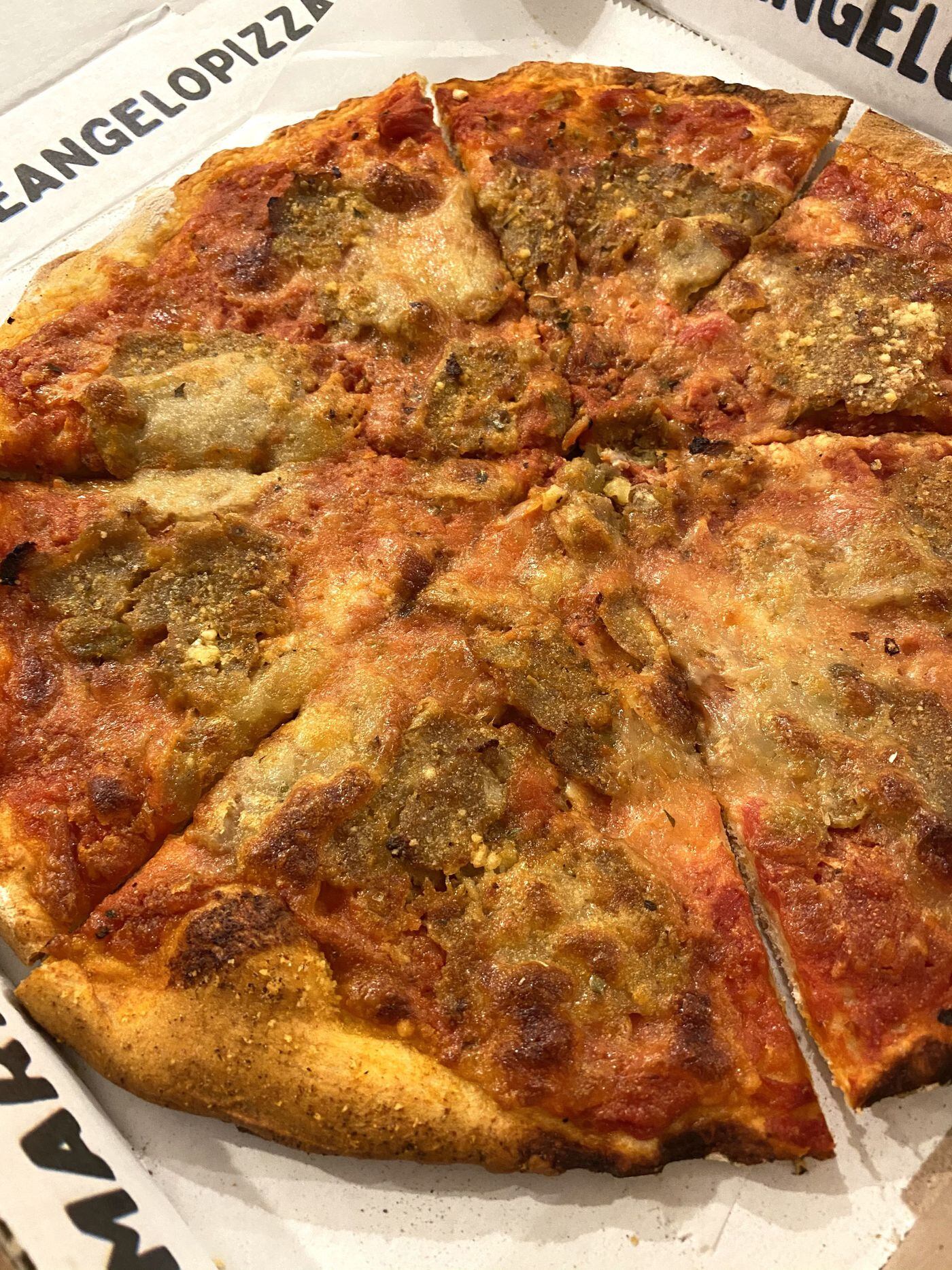 A Paulie pizza, topped with meatballs, at The Angelo Pizza shop.