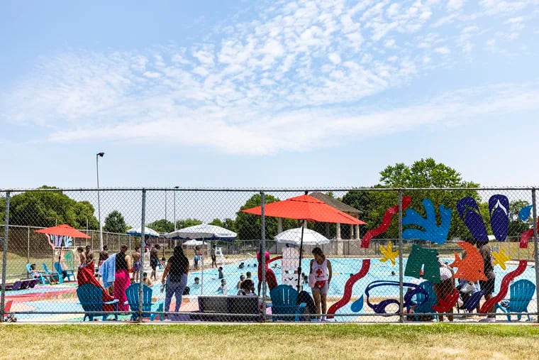 Families out enjoying an oasis from the urban heat at  at Hunting Park Pool on Tuesday, when the temperature hit 90 to kick off the first heat wave of the year.