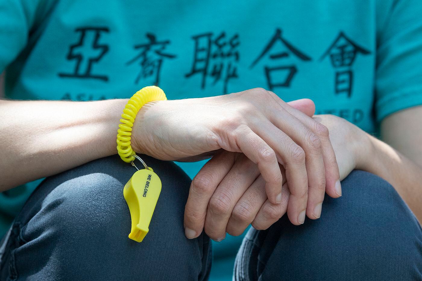 Alix Webb, executive director of Asian Americans United, is photographed wearing her yellow whistle on her wrist near her home in West Philadelphia on Tuesday, June 2.