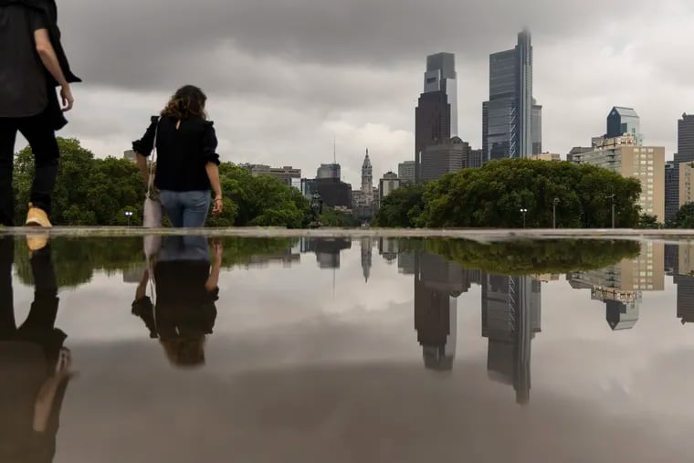 Clouds shroud the Center City skyline after storms passed through Philly in July. Heavy rains are possible on Wednesday, prompting a flood watch.