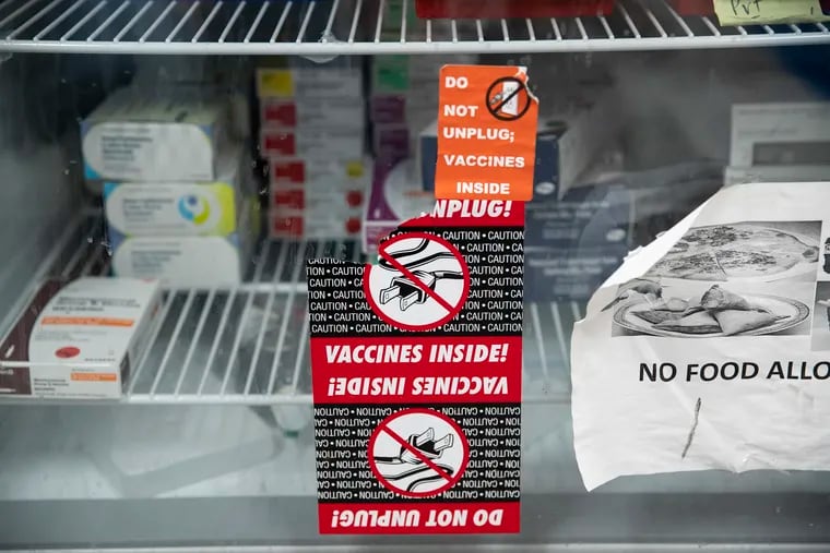 Vaccines fill a fridge in the pediatrics section at the City Department of Public Health, Health Center 10, in Philadelphia. Recently announced federal cuts will impact funding to a database that allows physicians to check the vaccines their patients have already received.