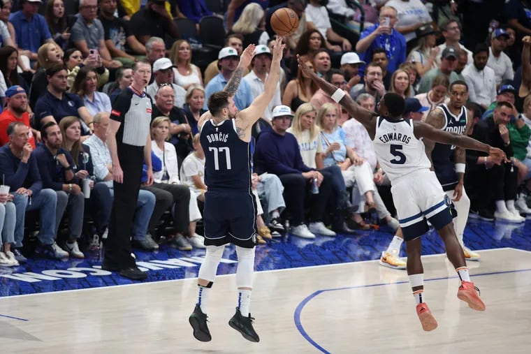 Luka Doncic #77 of the Dallas Mavericks attempts a shot against Anthony Edwards #5 of the Minnesota Timberwolves during the third quarter in Game Four of the Western Conference Finals at American Airlines Center on May 28, 2024 in Dallas, Texas. (Photo by Tim Heitman/Getty Images)