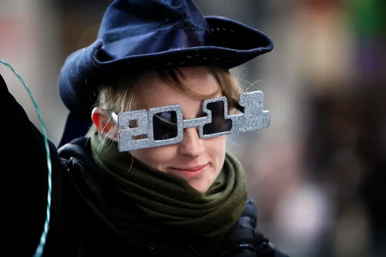 Karla Bussel sports her 2011 glasses as she struts up Broad Street with the Comics in the Mummers Parade on Jan. 1, 2011, which some say ushered in the new decade.