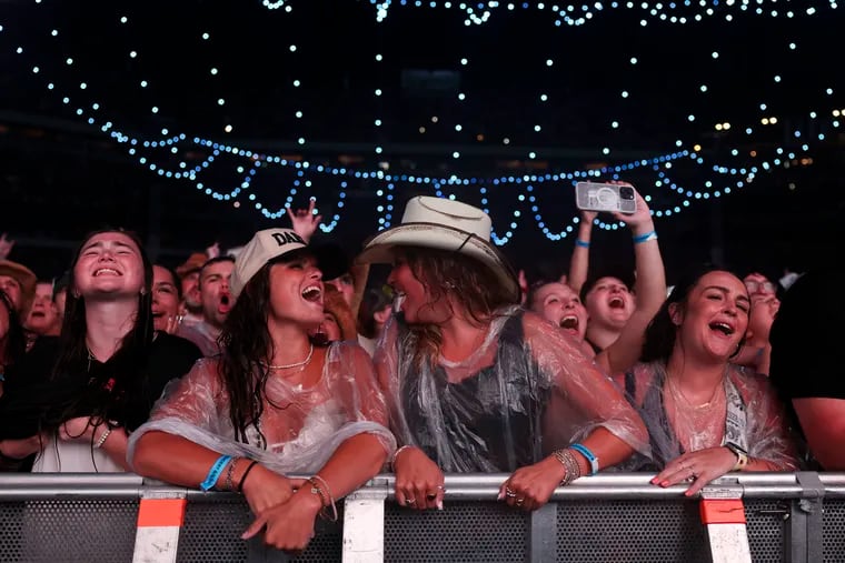 Fans cheer as Zach Bryan performs at Lincoln Financial Field in Philadelphia on Tuesday, Aug. 6, 2024. Bryan took stage an hour late due to severe rain storms that had 60,000 fans rush to shelter.