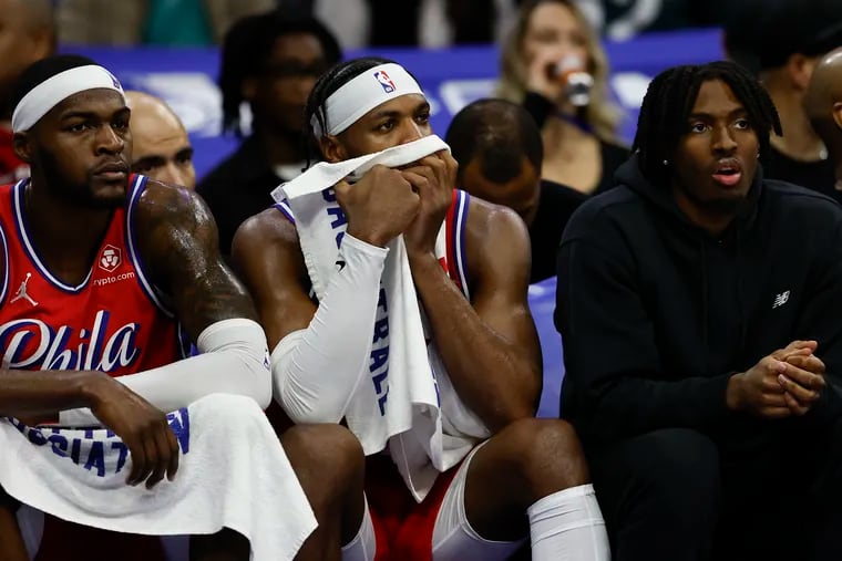 Sixers forward Paul Reed, guard Buddy Hield and injured guard Tyrese Maxey watch their teammate take on New Orleans Pelicans during the second quarter on Friday, March 8, 2024 in Philadelphia.