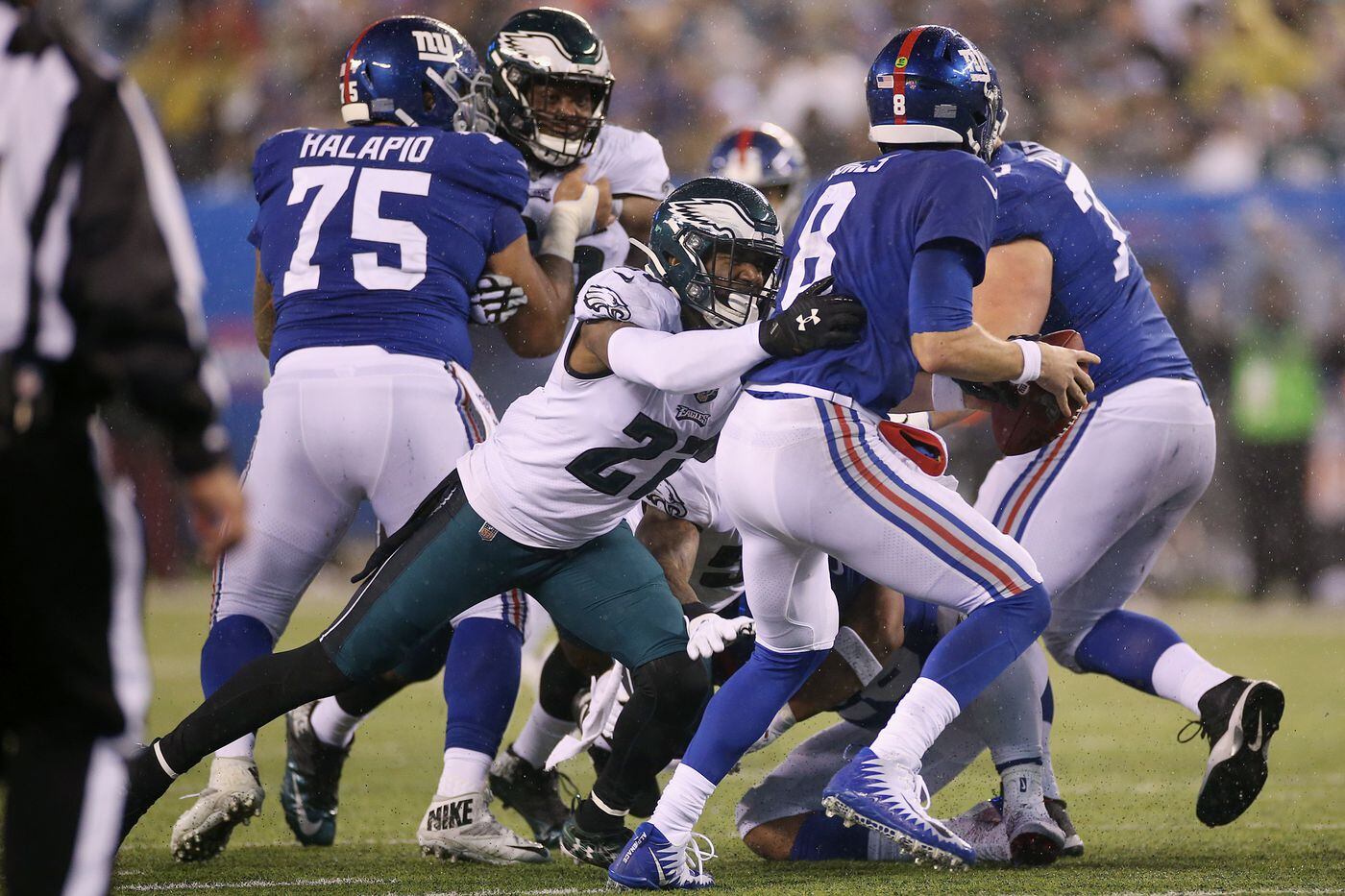 Eagles safety Malcolm Jenkins forces a fumble by New York Giants quarterback Daniel Jones on Dec. 29. 