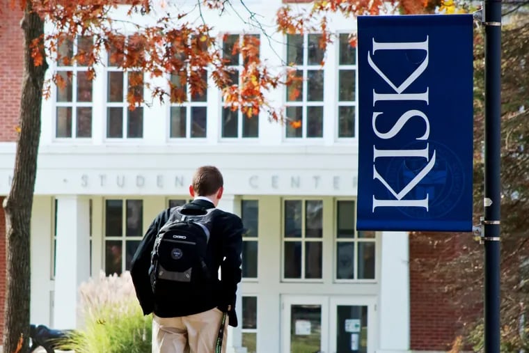 A student walks the campus of The Kiski School, a private school near Pittsburgh that has announced a tuition "reset" to reduce the cost of attendance.