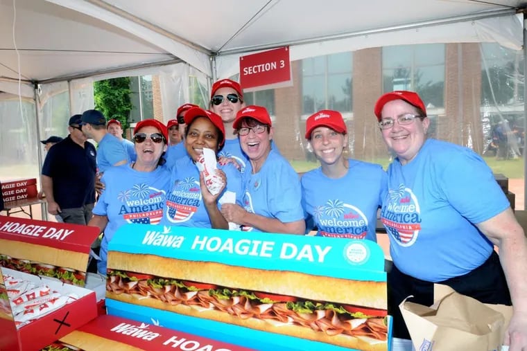 Wawa associates distribute free hoagies at the 2017 Wawa Hoagie Day.