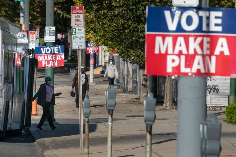 "VOTE MAKE A PLAN" signs along Market Street near 42nd Street in Philadelphia on Oct. 9, 2020.