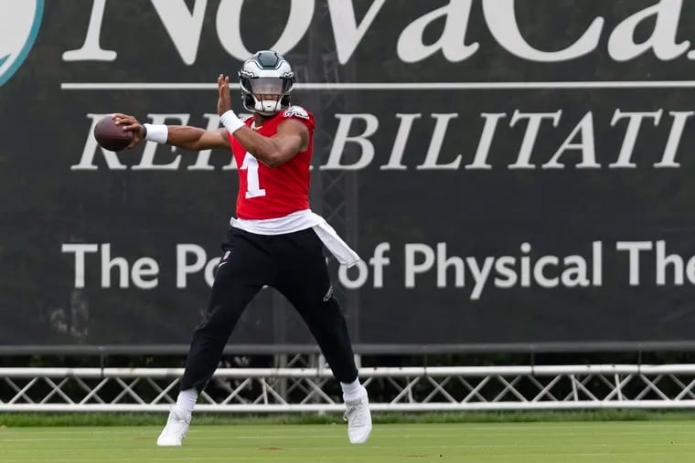 Jalen Hurts throws during the first day of Eagles training camp at the NovaCare Complex on Wednesday.