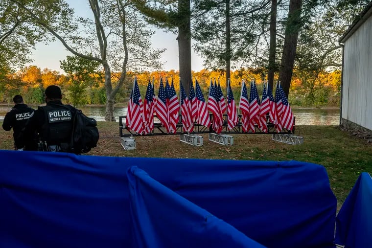 October 21, 2024: Secret Service officers leave after a presidential campaign appearance, behind the stage along the Delaware River in Washington Crossing, Bucks County.