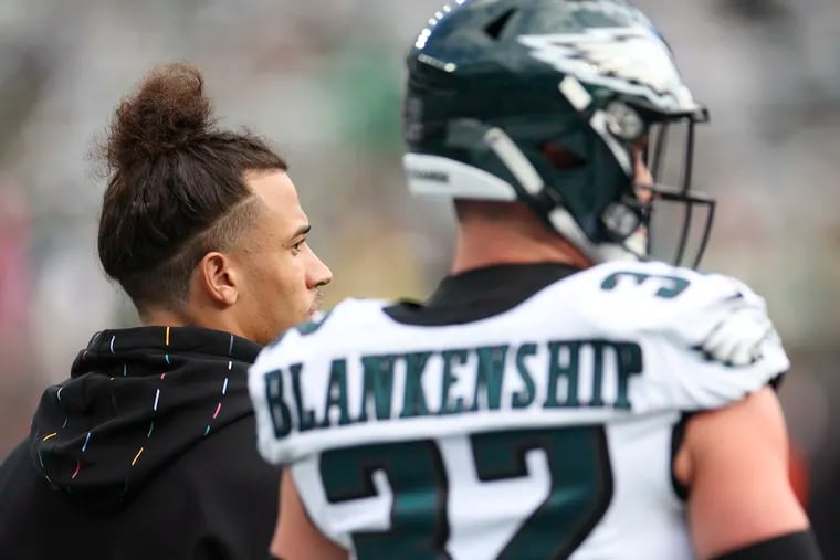 An injured Philadelphia Eagles safety Sydney Brown stands next to teammate Reed Blankenship before a game against the Jets at MetLife Stadium in East Rutherford, NJ on Sunday, Oct. 15, 2023. Jets won, 20-14.