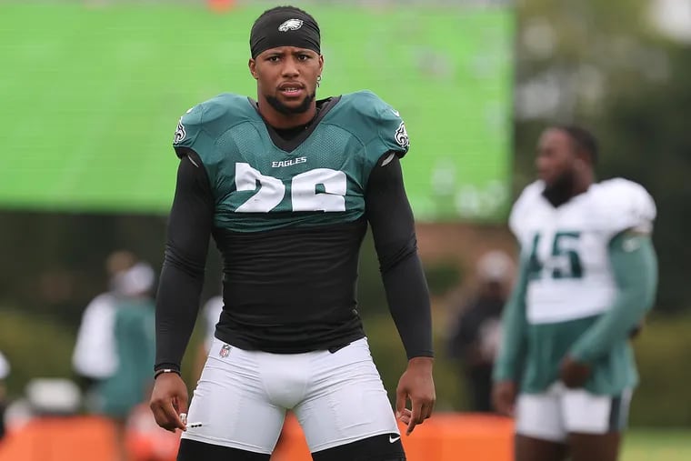 Eagles running back Saquon Barkley warms up during the training camp session at the NovaCare Complex on Sunday.