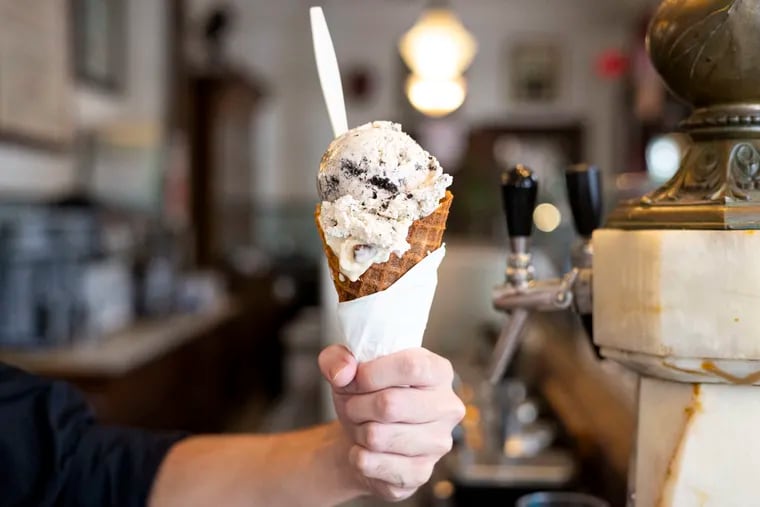 This double-scooped Butter Pecan and Hydrox Cookie on a waffle cone at Franklin Fountain costs about $17. Owner Eric Berley said customers are paying for "a premium high-end product that is artisanally made."