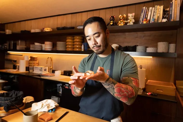 Chef-owner Jesse Ito at work at his omakase counter at Royal Sushi & Izakaya in Queen Village. He is planning to open a new izakaya near Rittenhouse Square.