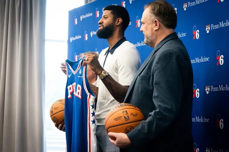 (Left to RIght) Paul George and Daryl Morey, shown here during George's introductory press conference at the Sixers training complex.