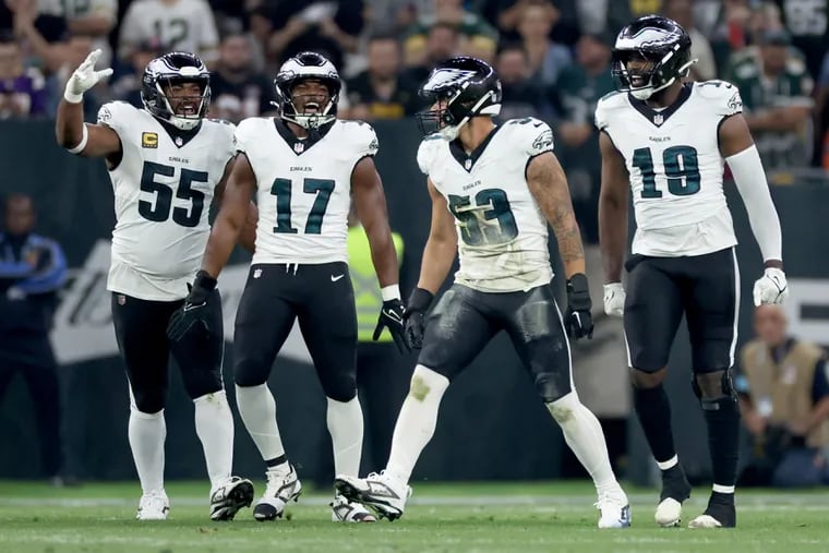 Philadelphia Eagles Brandon Graham, Nakobe Dean, Zack Baun, and Josh Sweat celebrate a defensive stop in the season opener against the Green Bay Packers.