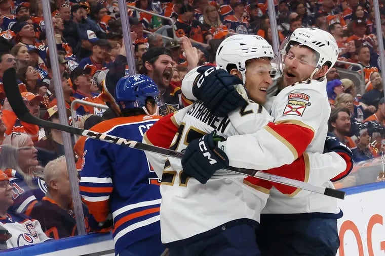 Eetu Luostarinen #27 and Vladimir Tarasenko #10 of the Florida Panthers celebrate after Tarasenko's goal against the Edmonton Oilers during the second period of Game Three of the 2024 Stanley Cup Final at Rogers Place on June 13, 2024 in Edmonton, Alberta, Canada.  (Photo by Bruce Bennett/Getty Images)