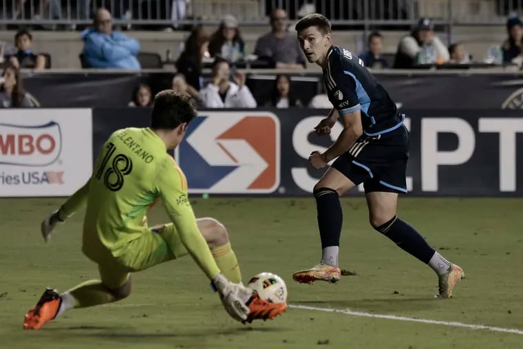 Union striker Mikael Uhre is stopped on a shot by Cincinnati goalkeeper Roman Celentano during the first half.