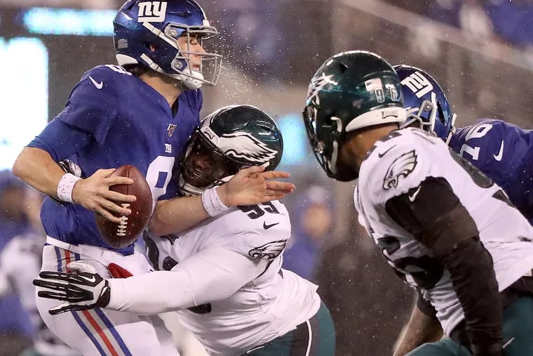 Eagles defensive tackle Tim Jernigan sacks Giants quarterback Daniel Jones in 2019.