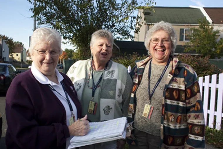 Green Ladies, Ruth O'Toole, left, Fran Baker, center, and Barbara Preston on patrol in Quakertown. (Ed Hille / Staff Photographer)