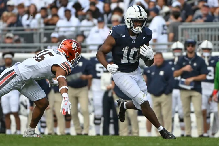 Penn State running back Nicholas Singleton (10) runs away from Bowling Green linebacker Avi McGary (15) during the second quarter on Saturday.