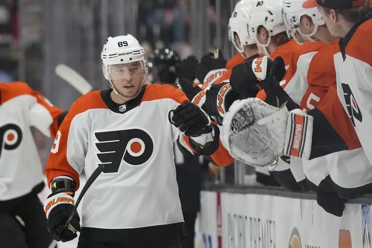 Flyers right wing Cam Atkinson celebrates with teammates after scoring in the first period. He also assisted on the opening goal of the night.