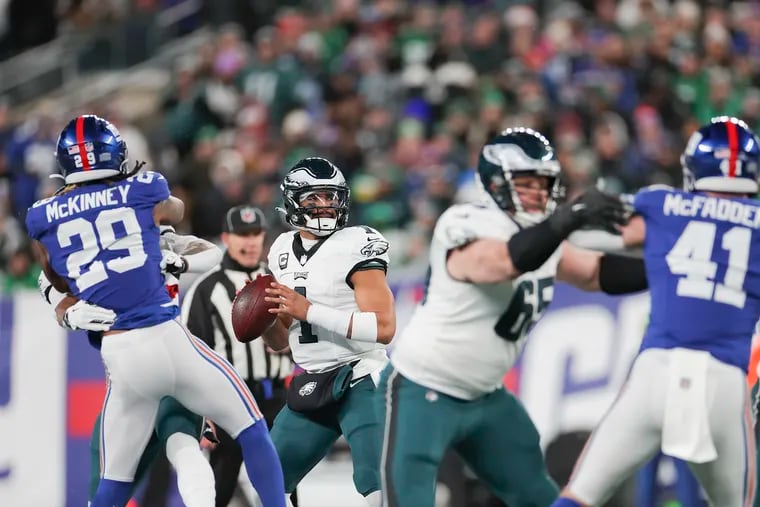 Eagles quarterback Jalen Hurts looks to throw during last season's game against the Giants at MetLife Stadium.