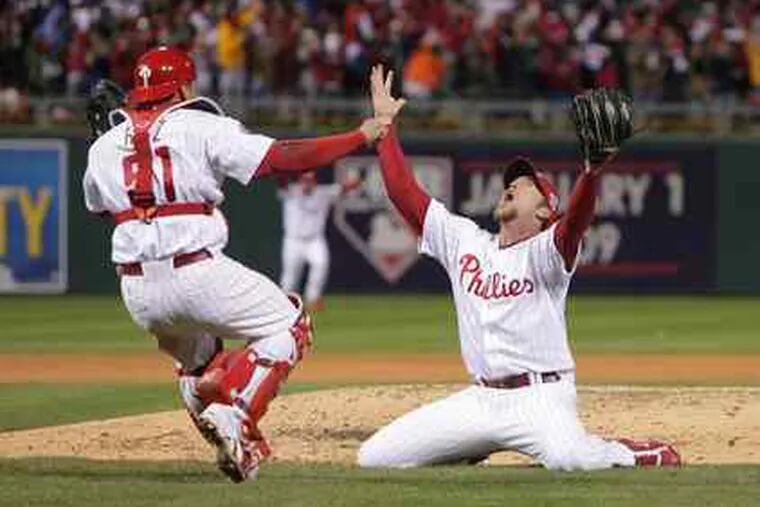 Philadelphia Phillies pitcher Brad Lidge reacts after striking out