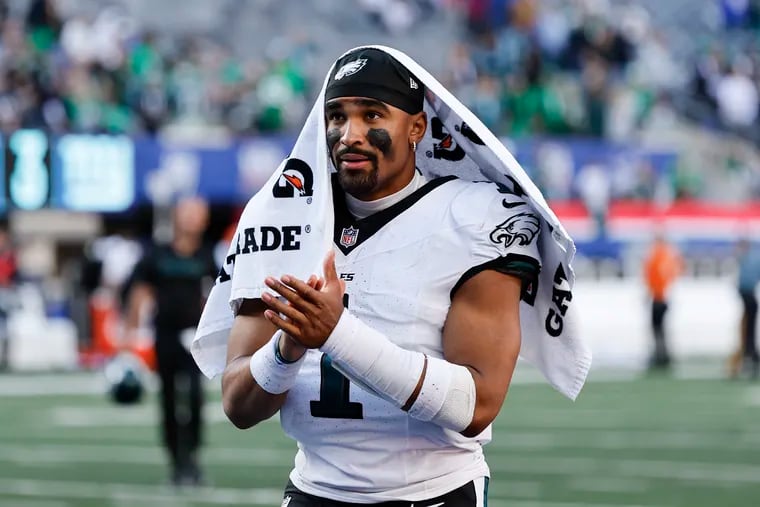 Jalen Hurts claps following the Eagles 28-3 win against the New York Giants at MetLife Stadium Sunday.