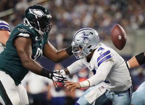 Helmets and gloves of a Dallas Cowboys and Philadelphia Eagles player, on  the field after their NFL football game, Sunday, Nov. 19, 2017, in  Arlington, Texas. (AP Photo/Michael Ainsworth Stock Photo - Alamy