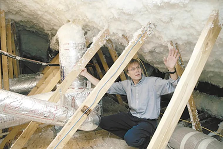 Government energy-efficiency researcher Jeff Christian in an attic undergoing a “retrofit” to cut energy costs in half. You can’t get those savings with caulk alone, but he says it’s a great start.