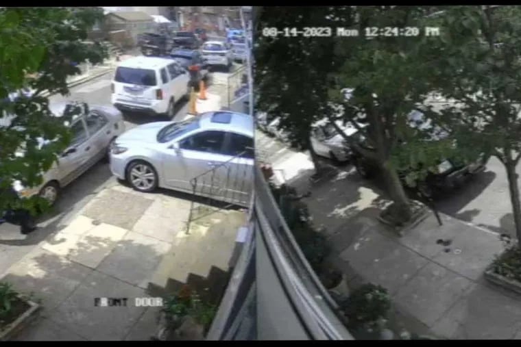 A sequence of images spanning 3 seconds of a surveillance video released by a lawyer for the family of Eddie Irizarry, show Officer Mark Dial approaching Irizarry’s Toyota Corolla in the100 block of East Willard Street with his gun drawn and then shooting Irizarry through the window, in Kensington on Monday Aug.14, 2023