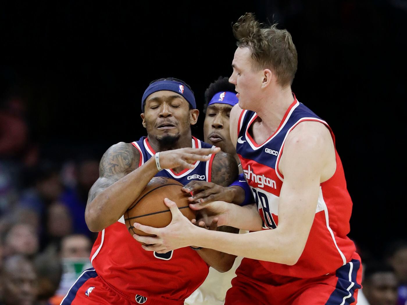 guard bradley beal defended by sixers guard josh richardson