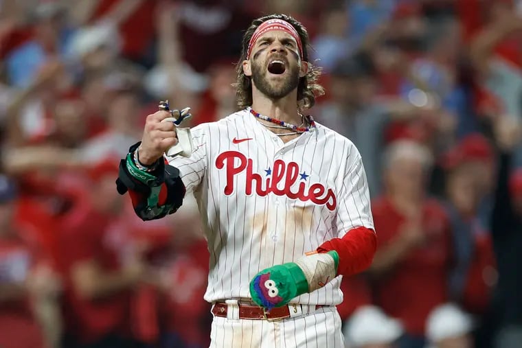 Phillies first baseman Bryce Harper yells after scoring against the Miami Marlins in Game 1 of the wild-card series.