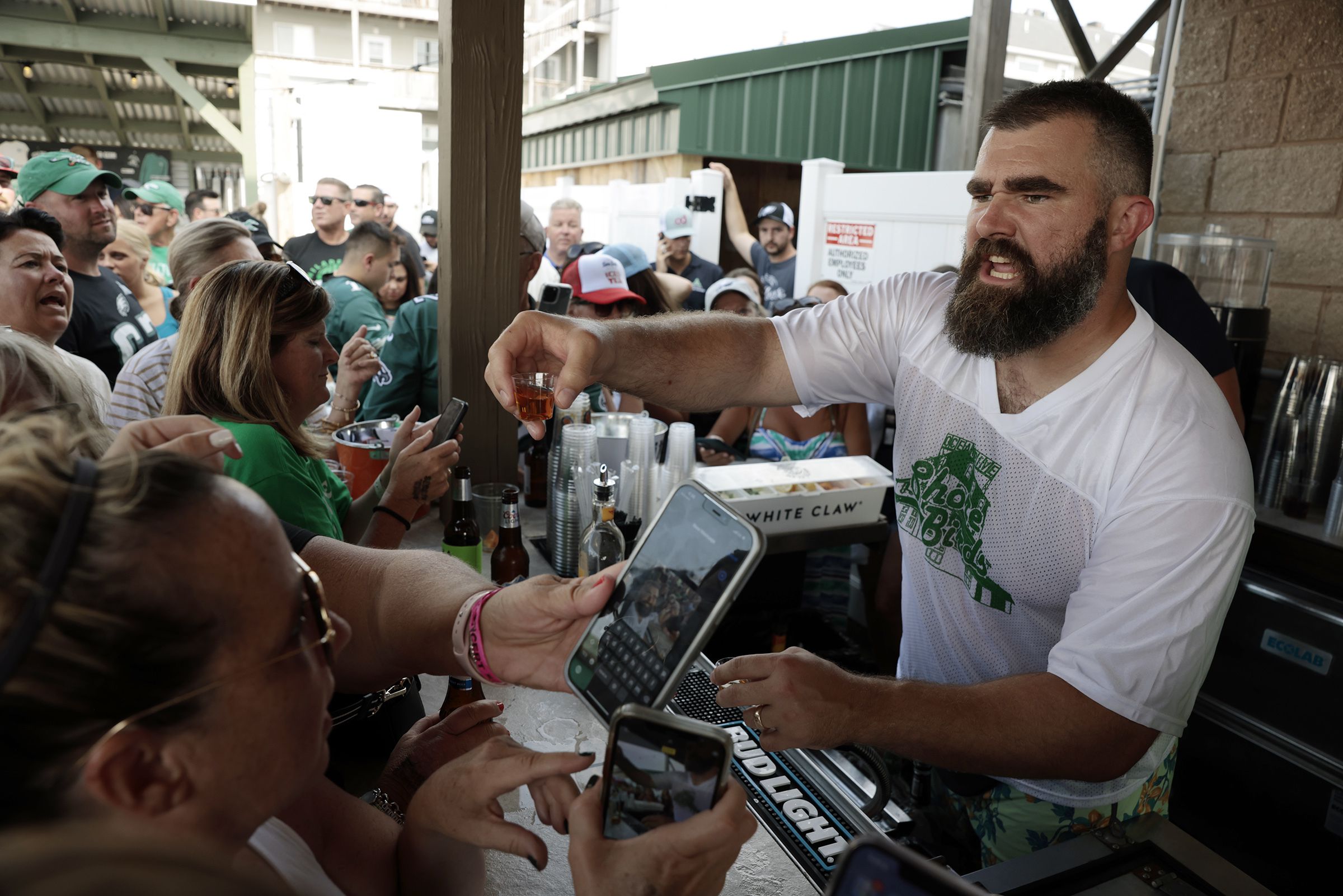 Why was Chiefs star Travis Kelce wearing an Eagles jersey and drinking beer  on Monday Night Football?