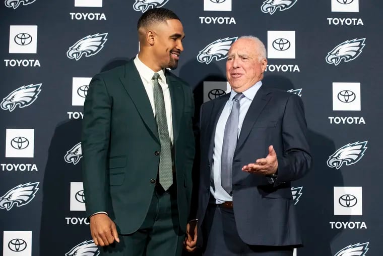 Philadelphia Eagles owner Jeff Lurie (right) is seen here with quarterback Jalen Hurts during a press conference at the NovaCare Complex in 2023.  The photo was taken after Hurts and the Eagles agreed to a five-year, $255 million contract extension.