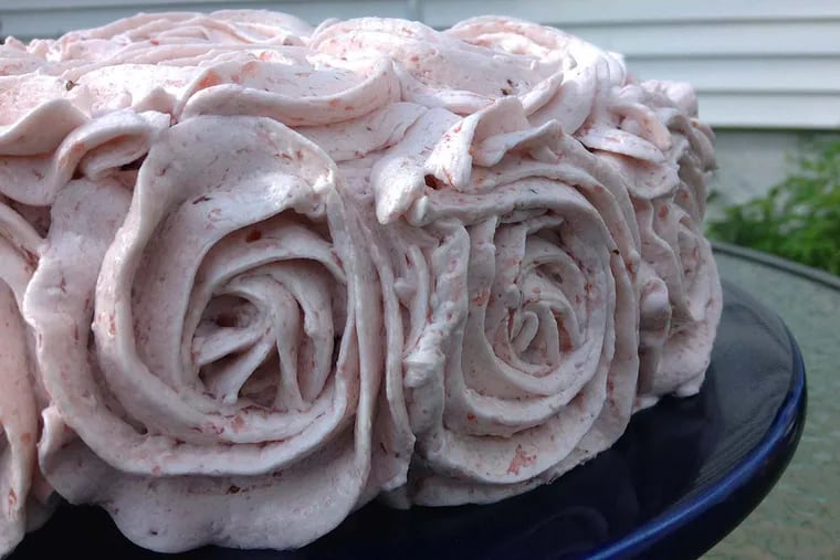 A vegan vanilla cake made with aquafaba on a recipe by Rebecca August, as baked and frosted with strawberry buttercream (aquafaba) icing by Linda Juilen.