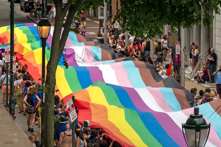 A 400-foot-long rainbow flag - the largest in Philadelphia history - moves along Walnut Street as Pride March and Festival kicks off with a march from Washington Square Sunday, June 2, 2024, with the theme, “Be You.”