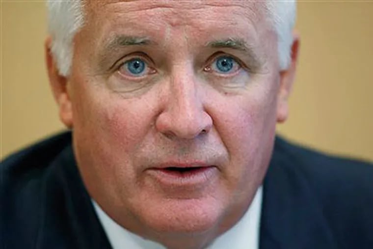 It's too hard to separate politics from the official actions of Pennsylvania Attorney General Tom Corbett. (AP Photo / Matt Rourke)