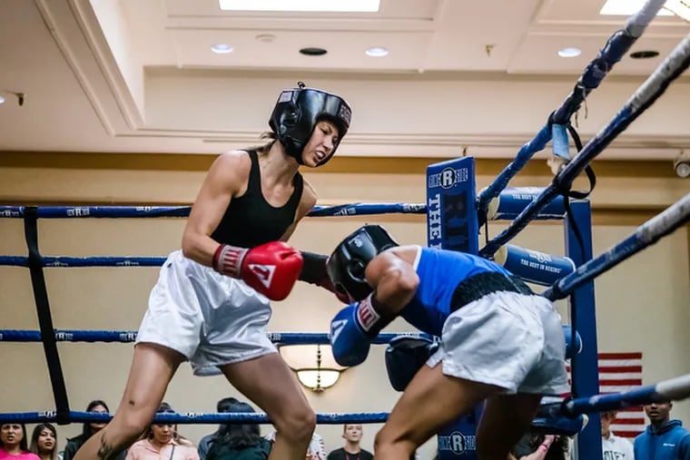 Lia Lewandowski (left) boxes Nathaly Ovando of Cedar Park, Texas, in an 110-pound bout at the Texas Women's Championship on Sept. 3, 2022.