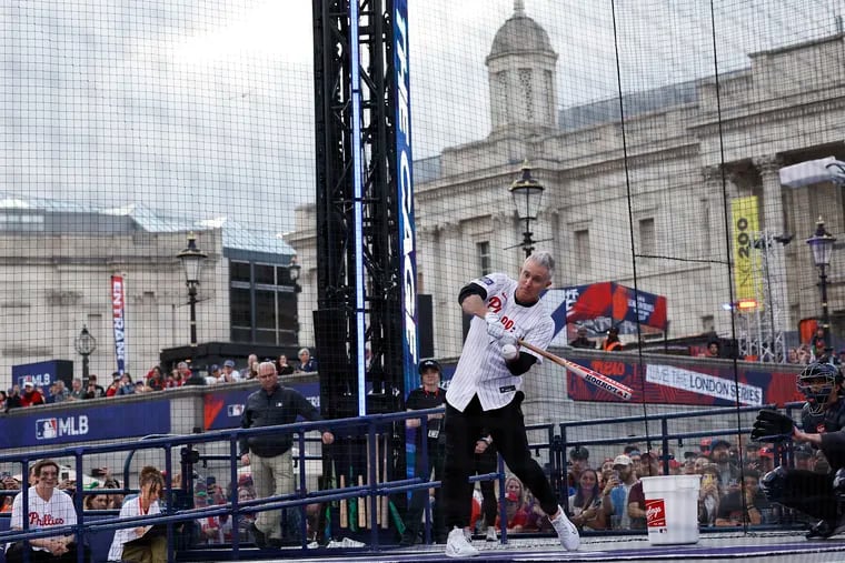 Former Phillies second baseman Chase Utley participates in a home run hitting contest inside The Cage during the Phillies and New York Mets London Series Trafalgar Square Takeover.